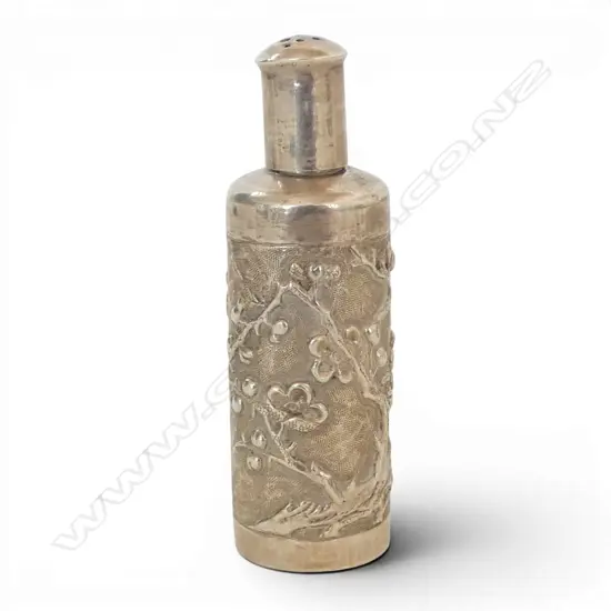 # A vintage Chinese silver embossed small shaker bottle. Blossom embossed. The lid with pierced holes. H.70mm. 21.5gms