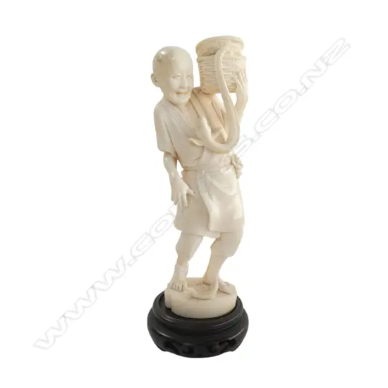 JAPANESE MEIJI PERIOD IVORY MAN WITH EEL, SIGNED TO BASE H.180mm + STAND