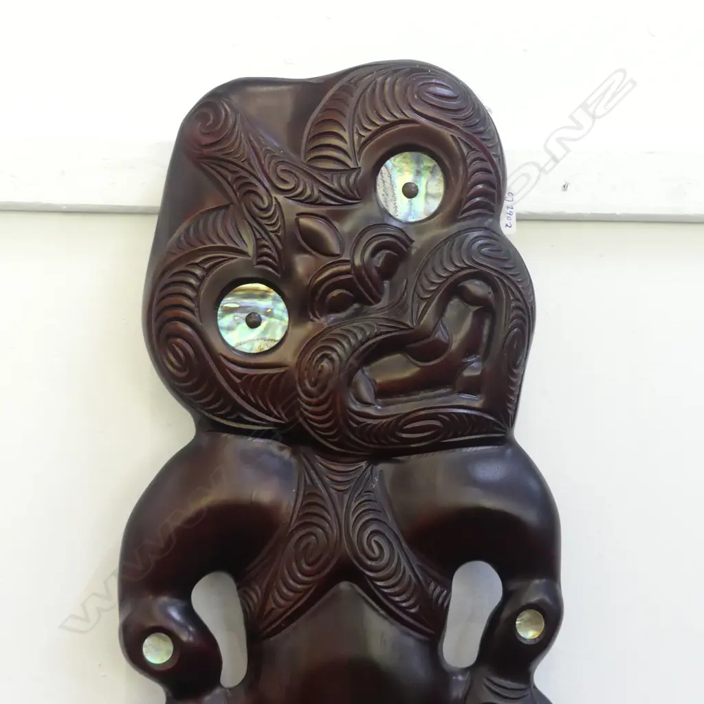 CONTEMPORARY CARVED TIKI WALL HANGING WITH PAUA INSETS (ROTORUA SCHOOL) H. 550mm (crack in leg) Image 1++