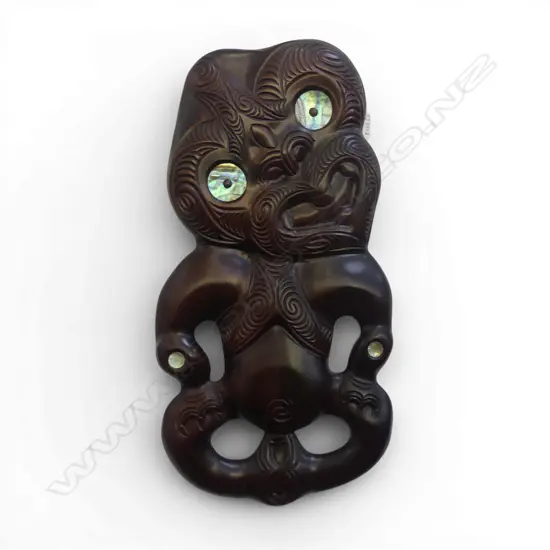 CONTEMPORARY CARVED TIKI WALL HANGING WITH PAUA INSETS (ROTORUA SCHOOL) H. 550mm (crack in leg)