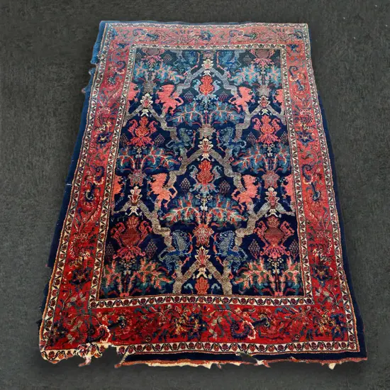 c.1930 IRANIAN WOOL/COTTON RUG, UNCONVENTIONAL HERALDIC IMAGERY, 2010 x 1320mm DAMAGE TO EDGES