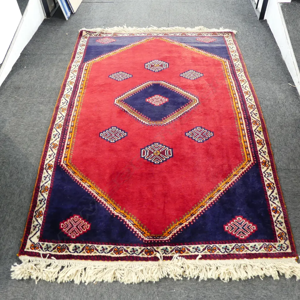 PERSIAN QASHQAI ALL WOOL RUG; 6 central medallions on plain red lustre ground 1830x1130mm Image 1++