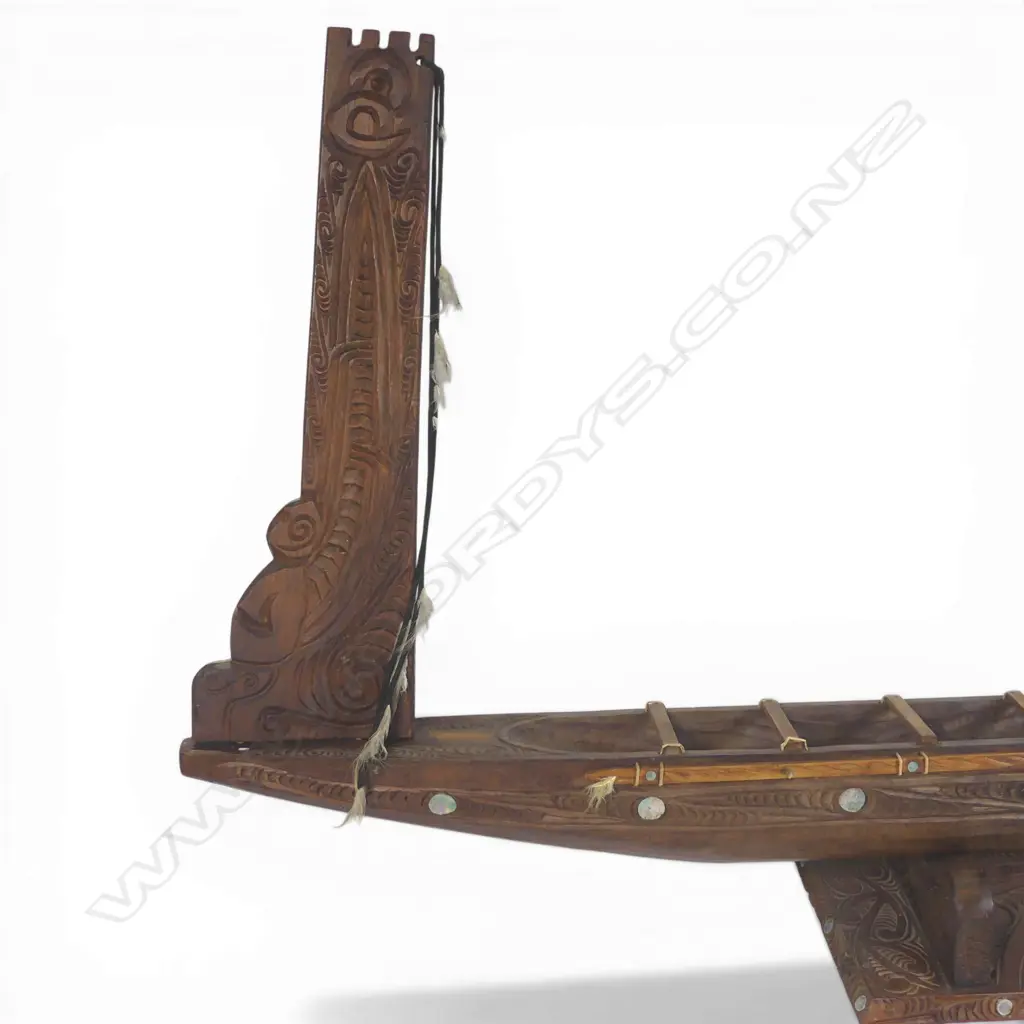 A large mid/late 20thC Māori carved wood model waka on carved stand, Image 1++