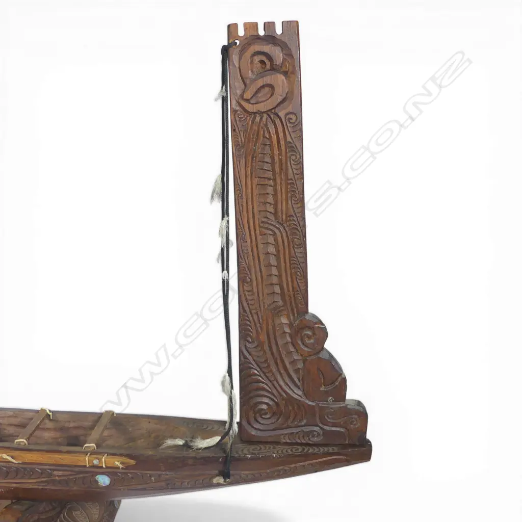 A large mid/late 20thC Māori carved wood model waka on carved stand, Image 1++