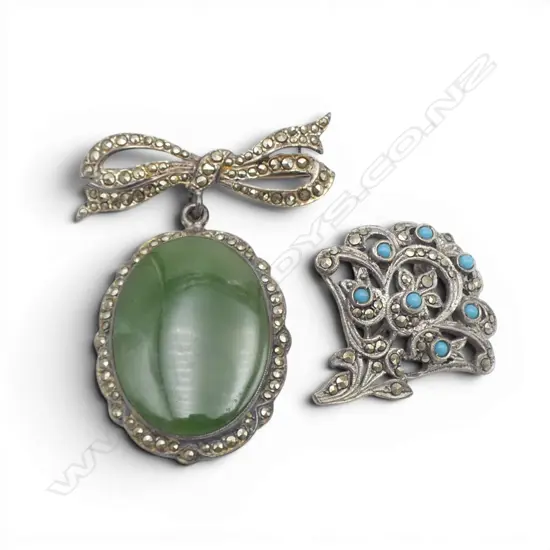 TWO SILVER AND MARCASITE BROOCHES ONE WITH POUNAMU AND ONE WITH BLUE BEADS