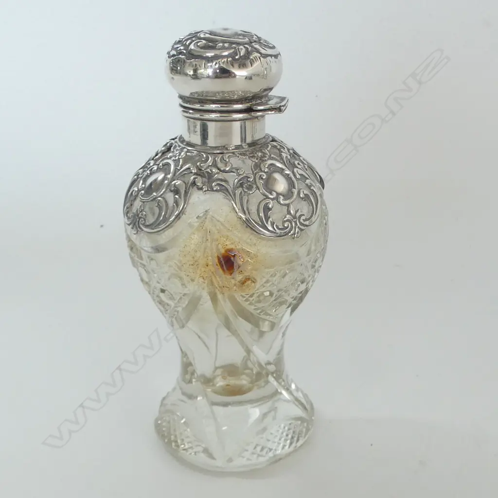 S/SILVER TOPPED PERFUME BOTTLE small dent to top Image 1++