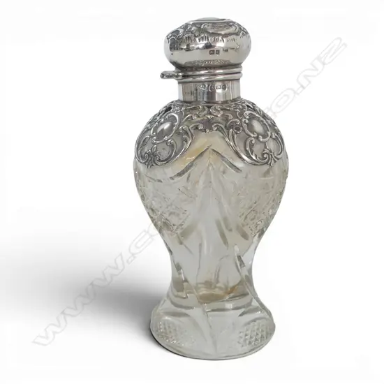 S/SILVER TOPPED PERFUME BOTTLE small dent to top
