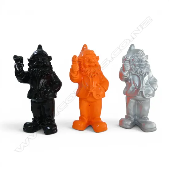 3 RESIN GNOMES HOLDING GUNS; BLACK, ORANGE & SILVER H.300mm