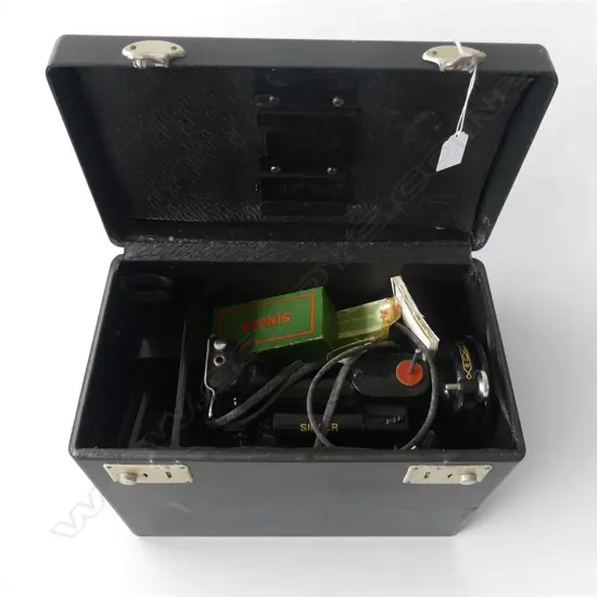 CASED ELECTRIC SINGER SEWING MACHINE with booklet etc