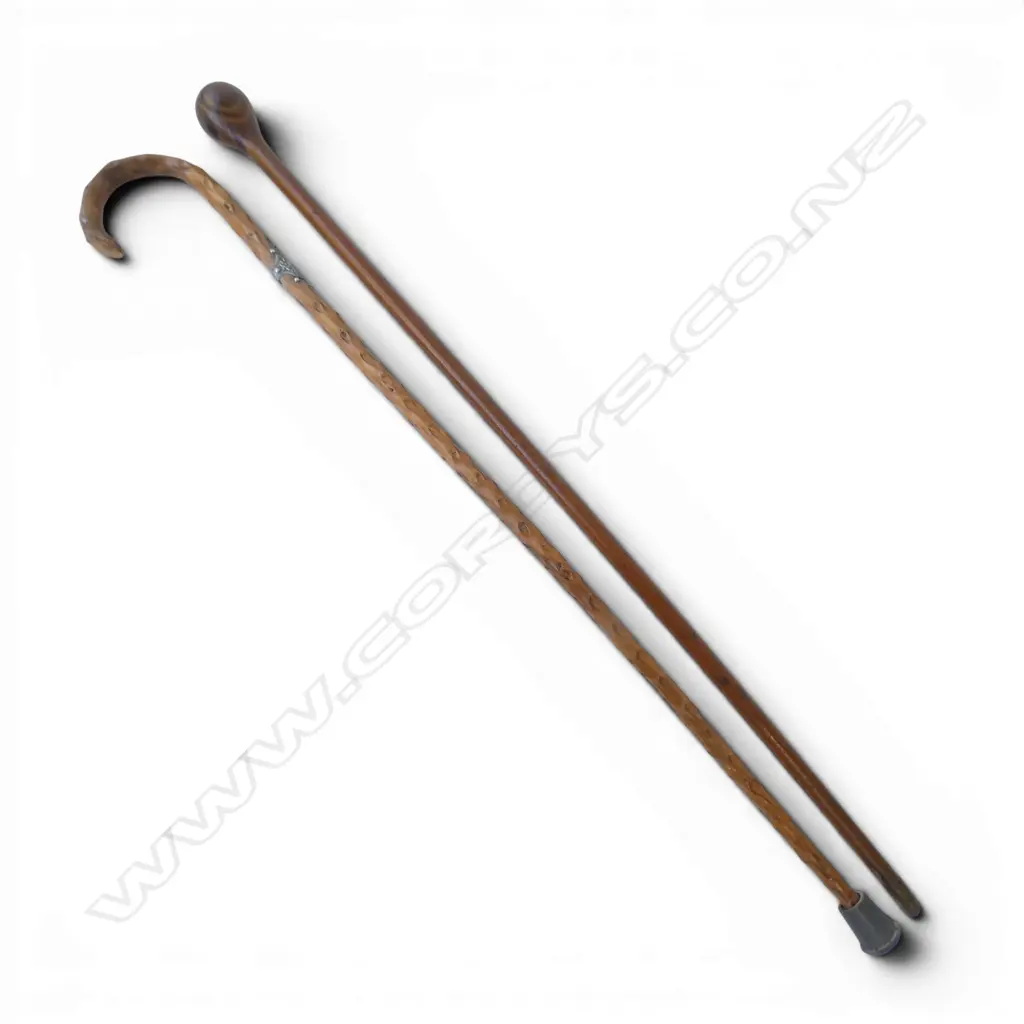 TWO EARLY 20thC WOODEN WALKING STICKS. 1 w segmented knob handle. 1 of briar or knobble wood stg fitting Image 1++