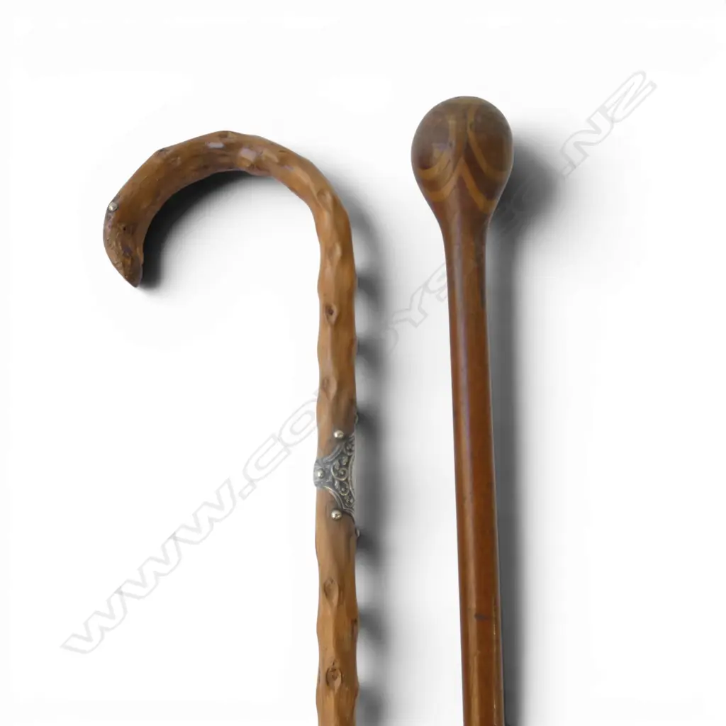 TWO EARLY 20thC WOODEN WALKING STICKS. 1 w segmented knob handle. 1 of briar or knobble wood stg fitting Image 1++