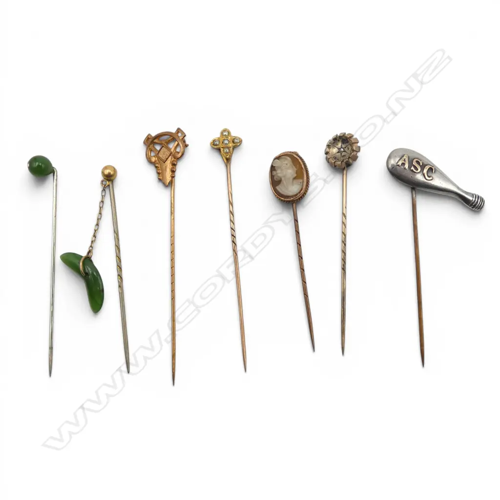 7 ANTIQUE STICK PINS, 2 9ct gold topped, 1 9ct top & pin, 2 pounamu & silver ASC badge Image 1++