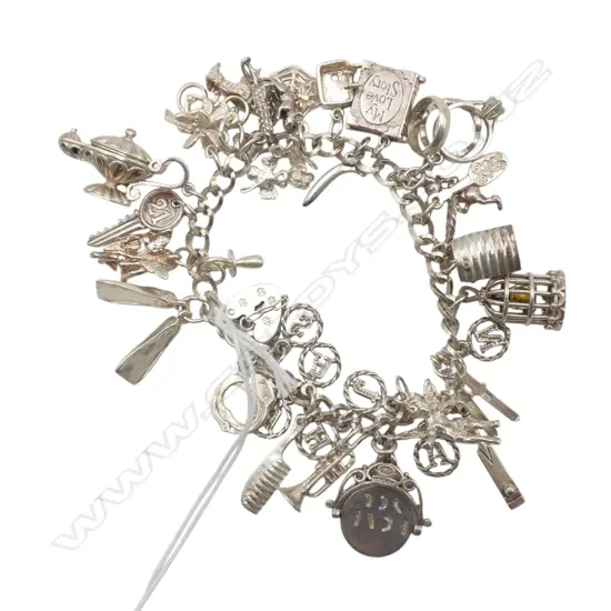 S/SILVER MULTI CHARM BRACLET 62.8GMS