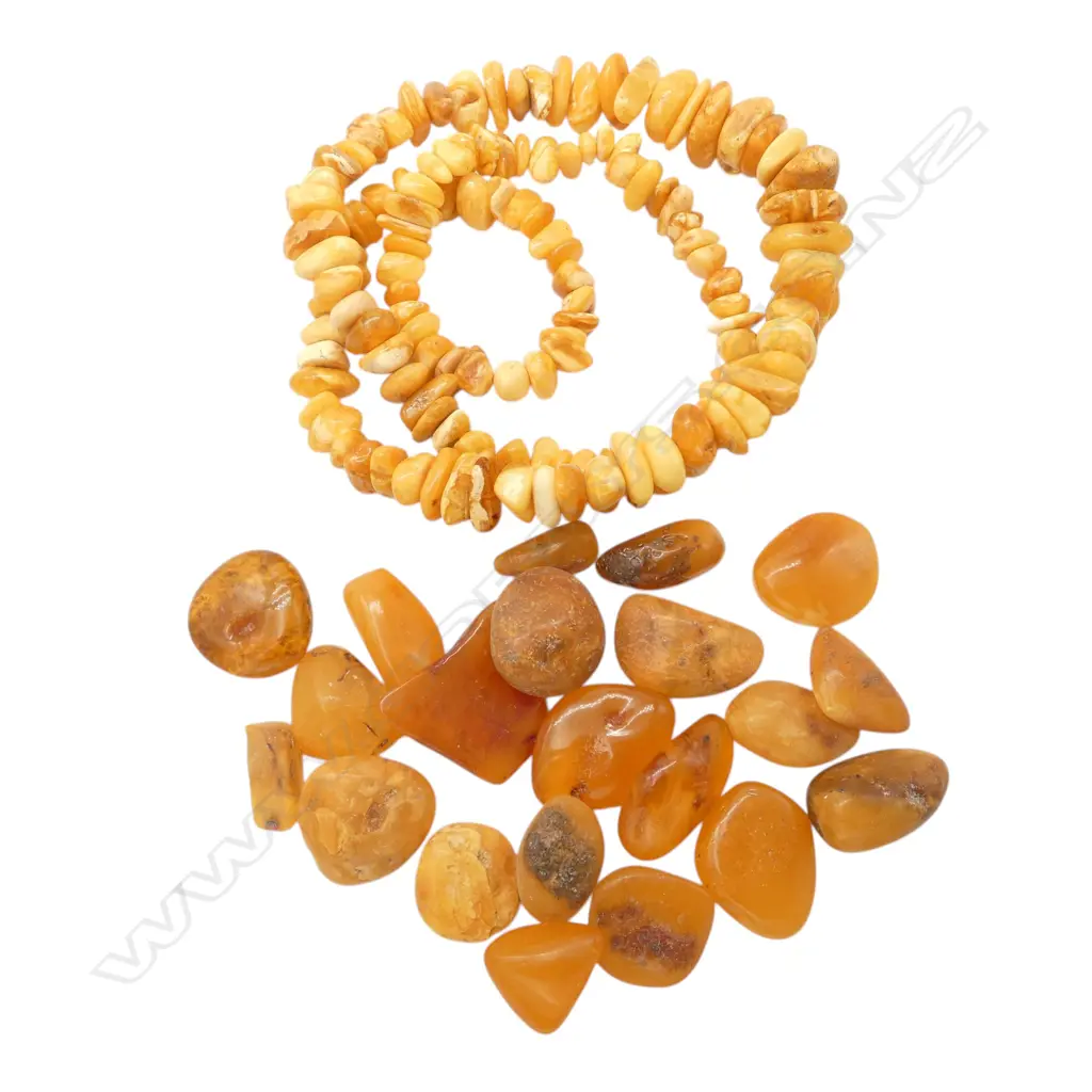 CHUNKY EGG YOKE YELLOW AMBER NECKLACE & BAG OF AMBER PIECES From the estate of jeweller Simon Misdale Image 1++