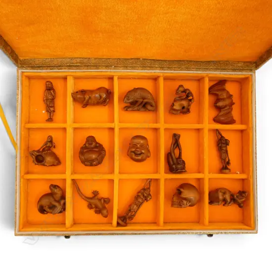 Boxed collection of 15 carved wooden signed netsukes. Various subjects including: bat - skulls - animals  etc.
