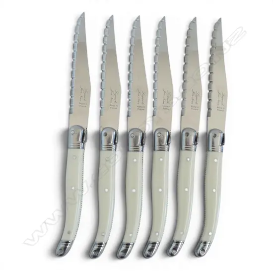 6 LAGUIOLE WHITE HANDLED STEAK KNIVES MADE IN FRANCE