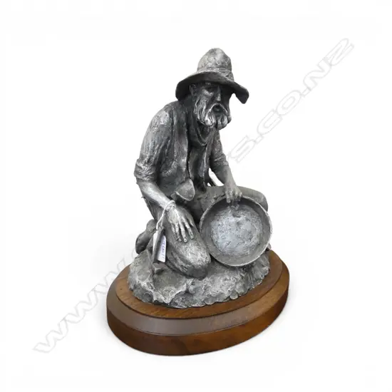 NUMBERED SIGNED FIGURE OF GOLD MINER ON WOOD BASE H310MM