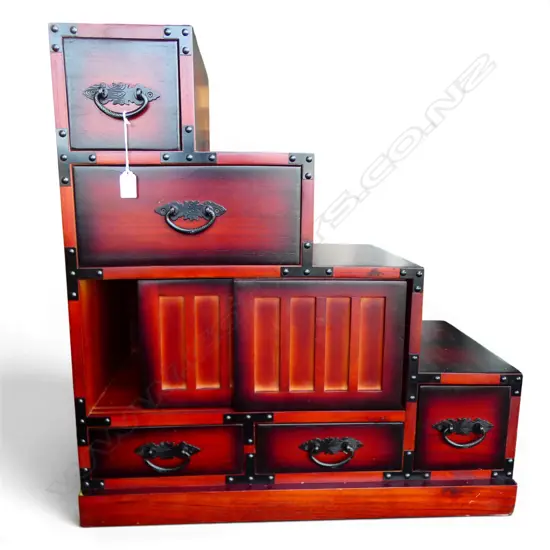 JAPANESE PAULOWNIA WOOD KAIDAN TANSU (small step chest) H.700mm W.670mm. D.340mm, Red & dark edged finish. Late 20thC