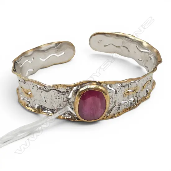 Designer silver with gold wash & large oval facet cut enhanced ruby cuff 28gms