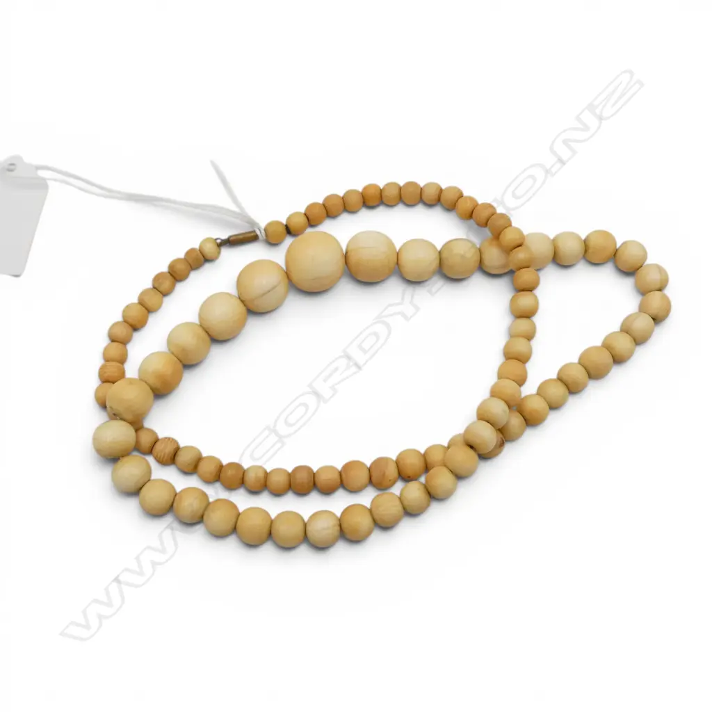 STRING OF IVORY GRADUATED BEADS L290MM Image 1++