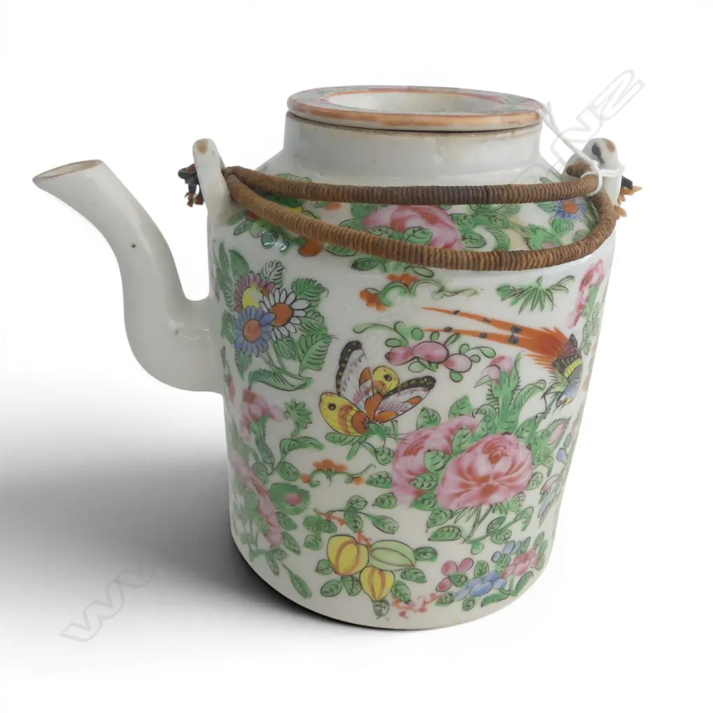 Chinese famille rose teapot of cylinder shape decorated in traditional manner with florals butterflies & birds. H.155mm Image 1++