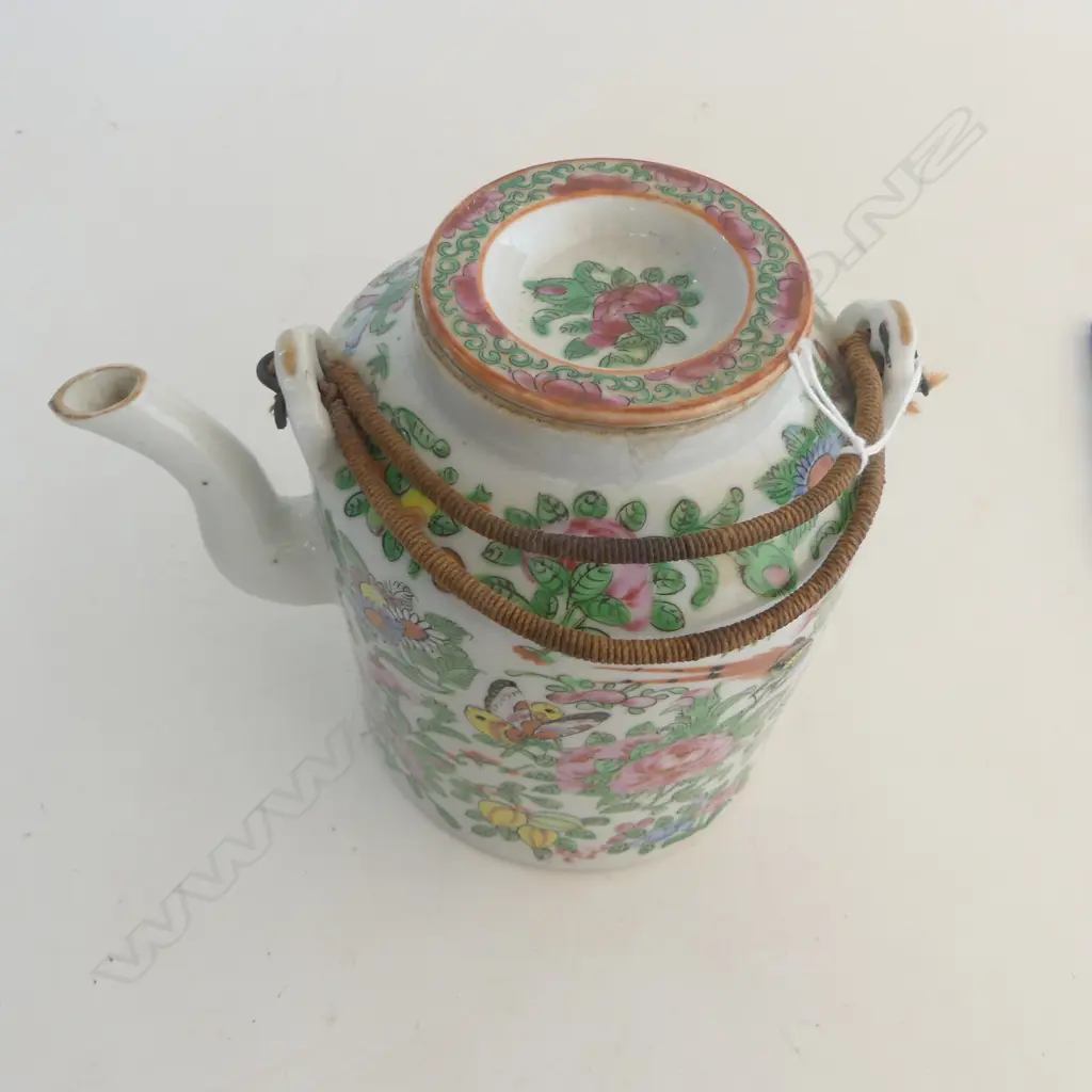 Chinese famille rose teapot of cylinder shape decorated in traditional manner with florals butterflies & birds. H.155mm Image 1++