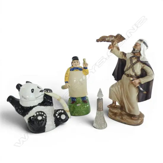 4 PCES; STG SILVER RIMMED BOTTLE (AF), BESWICK PANDA TEAPOT, GERMAN MUSICAL FIGURINE, ARAB MAN w. EAGLE H.310mm