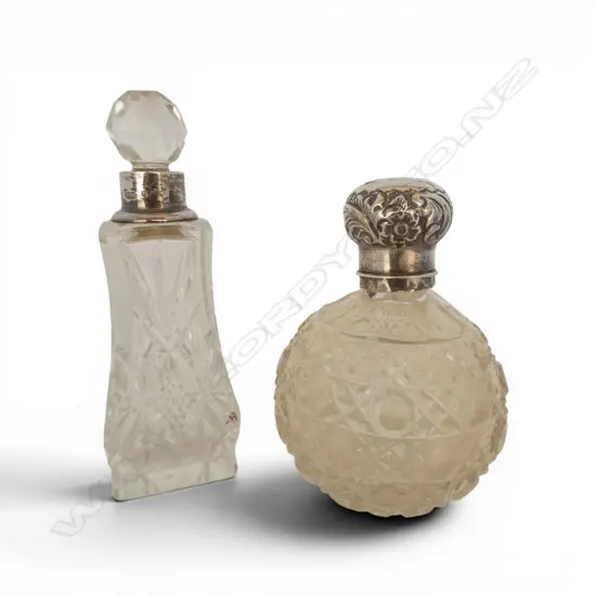 2 CUT CRYSTAL & SILVER TOPPED SCENT BOTTLES  top faulted. Birmingham 1910 & London 1901 