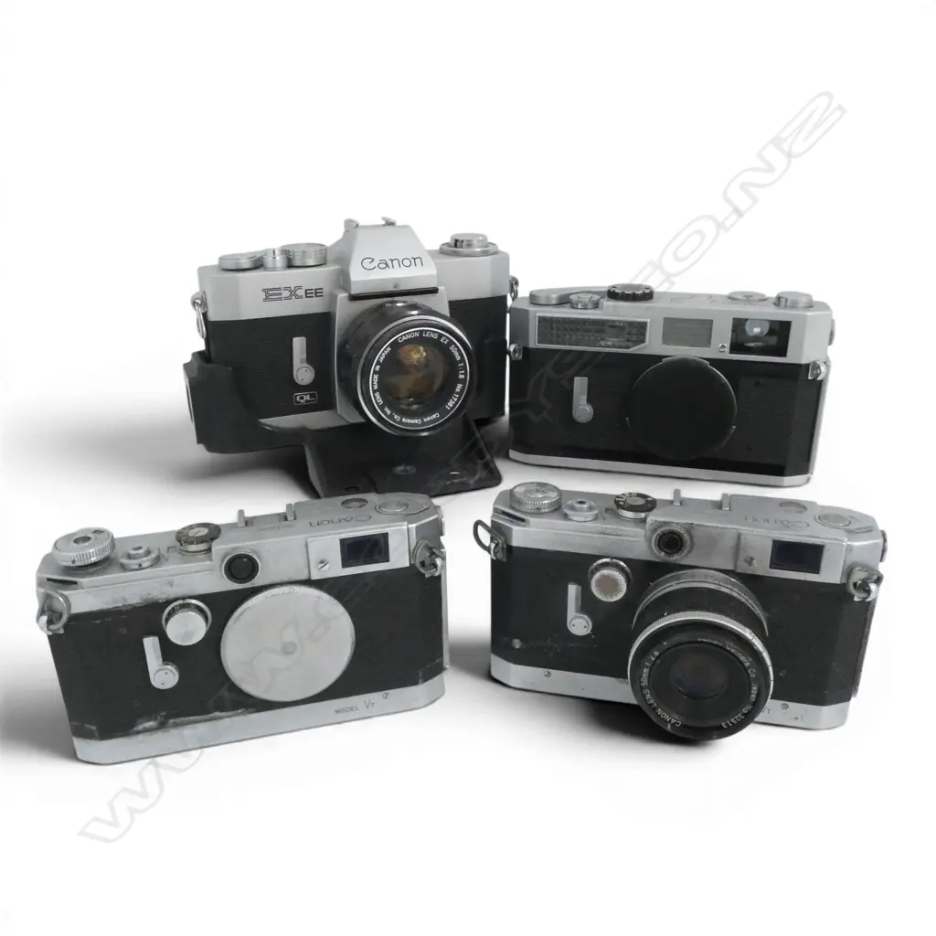 4 VINTAGE CANON CAMERAS Image 1++
