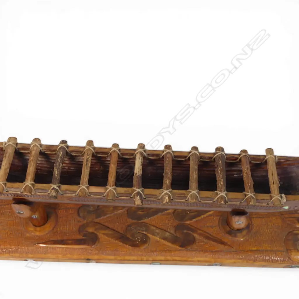 A large mid/late 20thC Māori carved wood model waka on carved stand, Image 1++