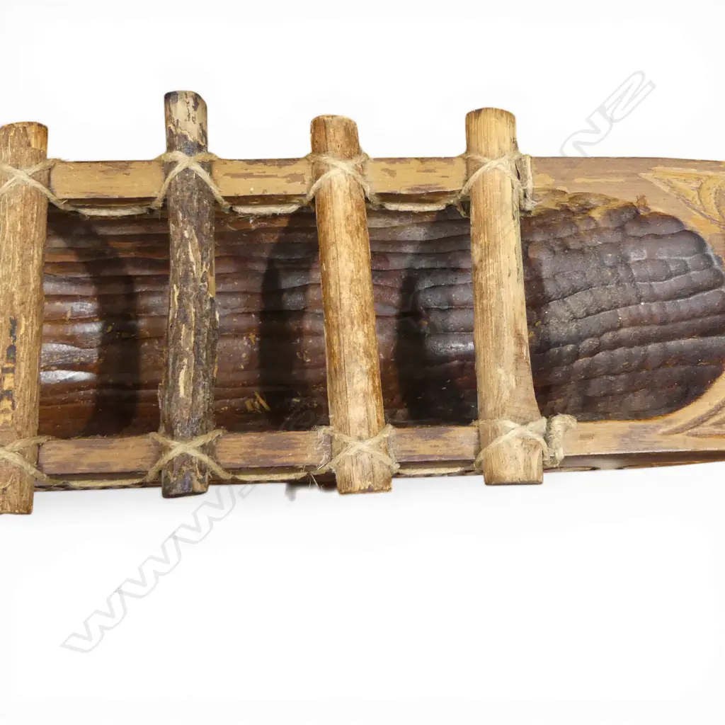 A large mid/late 20thC Māori carved wood model waka on carved stand, Image 1++