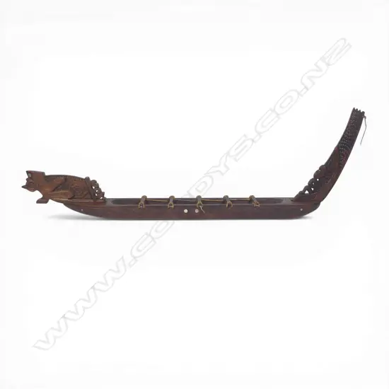 A mid/late 20thC Māori native carved wood model waka,