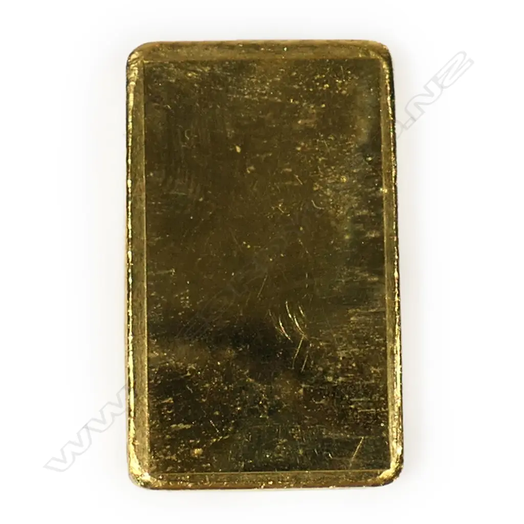 # An Auckland Coin and Bullion one-ounce .999 gold ingot,  cast maker's details. In cellophane sleeve. With copy of purc Image 1++