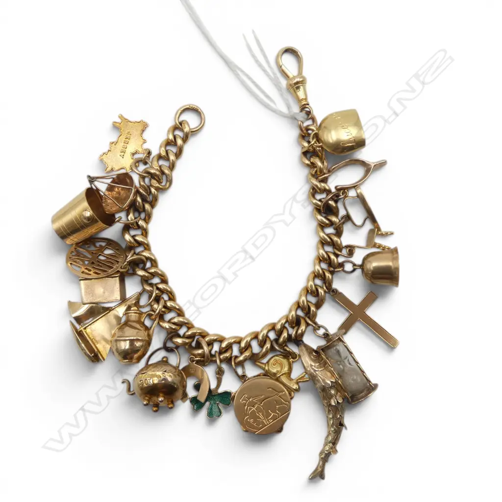VINTAGE 18ct GOLD CHARM BRACELET with 18ct clasp + multiple charms mostly 9ct. + 18ct snail + 18ct tambourine. 58.2gms Image 1++