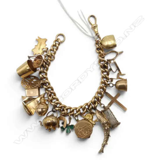 VINTAGE 18ct GOLD CHARM BRACELET with 18ct clasp + multiple charms mostly 9ct. + 18ct snail + 18ct tambourine. 58.2gms