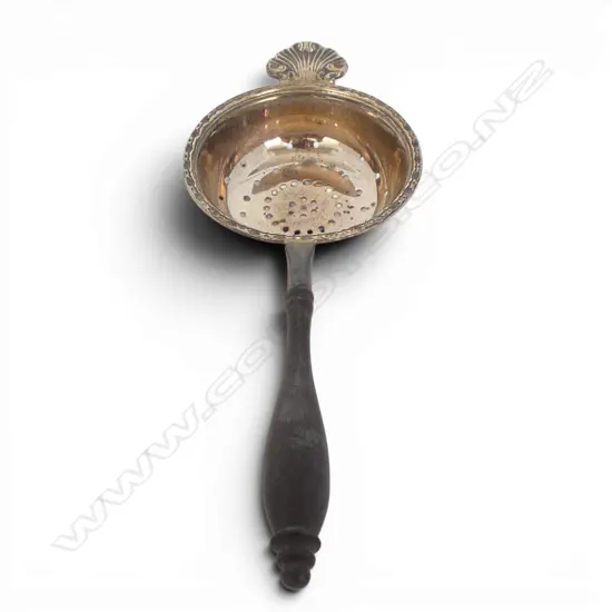 Birmingham 1983 QUALITY SILVER TEA STRAINER with shell detail & turned wooden handle.