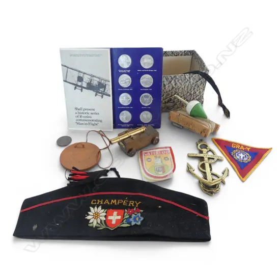 Box of vintage 'Champery' garrison cap + fishing line + military items + mini canon + anchor door knocker + coin set