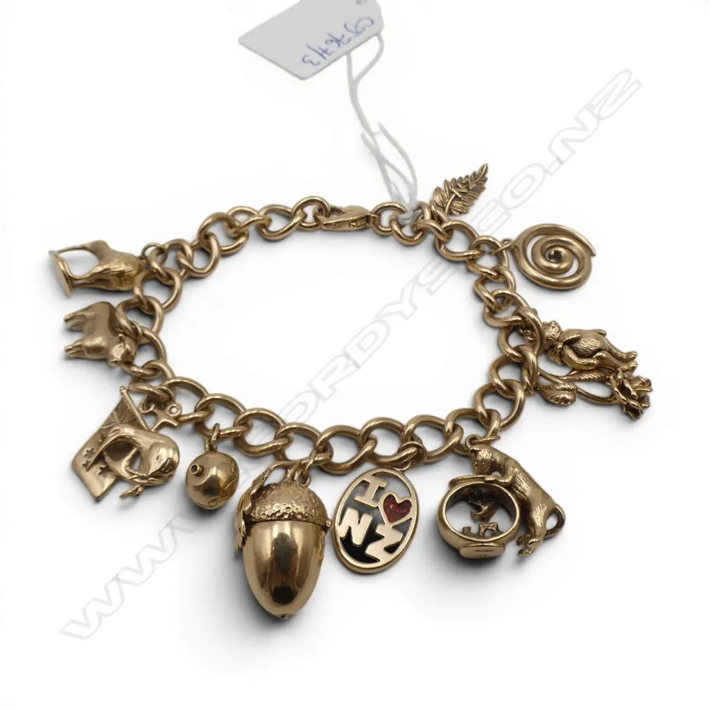 9CT CHARM BRACELET w. 11 9CT CHARMS, 53.3gms Image 1++