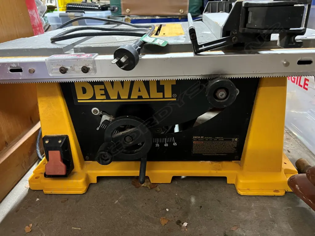 DeWalt DW744-XE ELECTRIC BENCH SAW 250mm blade 1600W. Paint flaking to top. 675 x 565 x 330mm. Image 1++