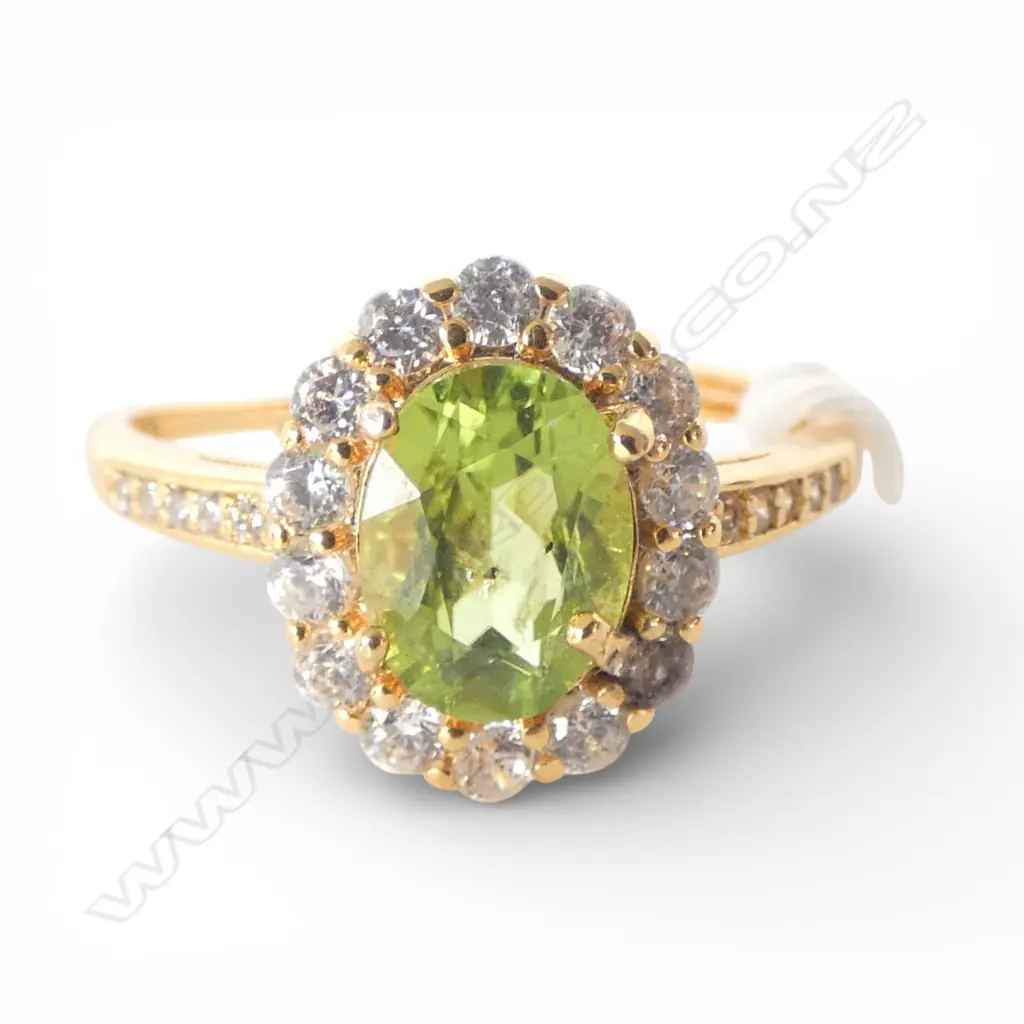 PERIDOT & CZ DRESS RING, GILT FINISH, AIG REPORT, one cz discoloured, adjustable band  size Image 1++