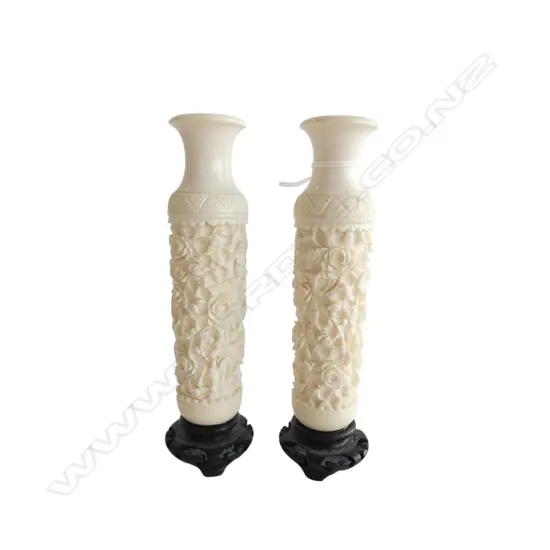 Pair Chinese carved ivory bud vases on wooden bases. 1 small chip. H.145mm
