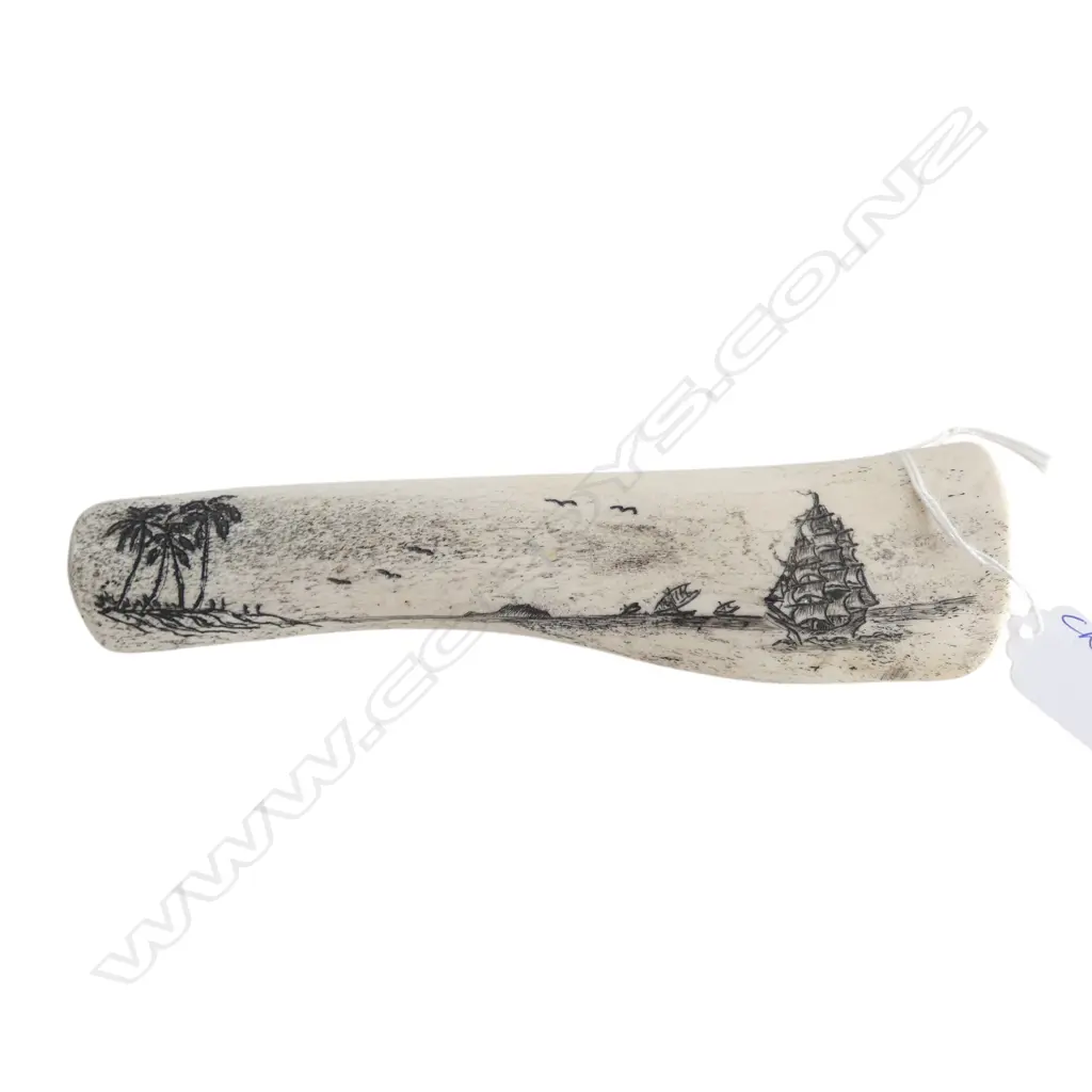 20thC Tongan scrimshaw on cow bone. Coastal tropical scene w sailing ship. L.190mm Image 1++