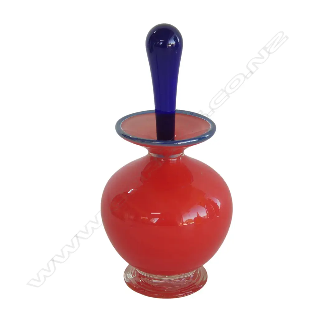 Jerry Reilly (WA) 1997 red bodied art glass perfume bottle with long blue stopper. H.140mm Image 1++