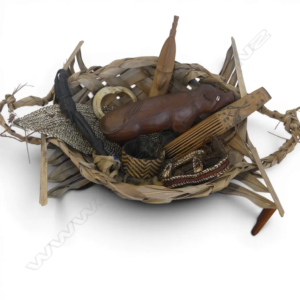 ASST. TRIBAL ITEMS IN WOVEN FLAX BASKET Image 1++