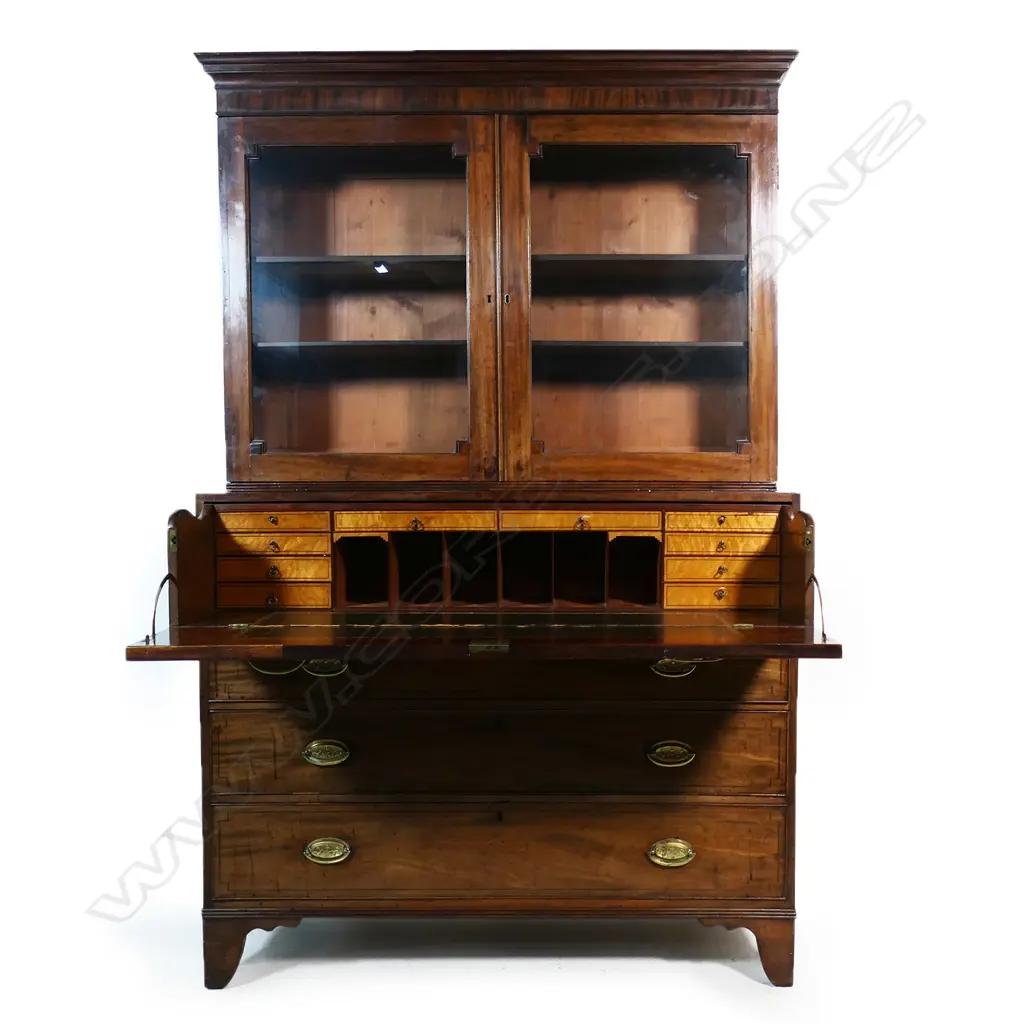 A Victorian mahogany bookcase/secretaire the glazed top with restrained pediment and two interior shelves the base with secretaire drawer over three full width drawers raised on bracket feet. 1270 x 540 x 2050mm. Image 1++