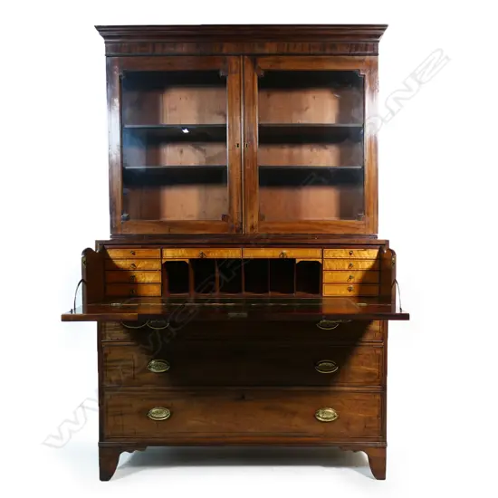 A Victorian mahogany bookcase/secretaire the glazed top with restrained pediment and two interior shelves the base with secretaire drawer over three full width drawers raised on bracket feet. 1270 x 540 x 2050mm.