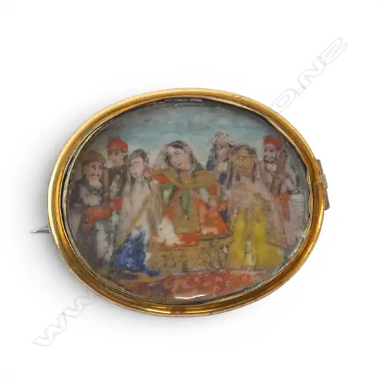 INDIAN GILT BROOCH hand painted on ivory under rock crystal?, worn condition W.45mm