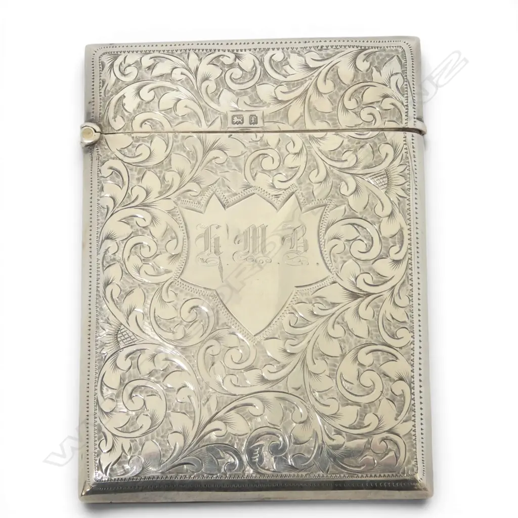 A quality silver leafy scroll engraved card case. Birmingham 1905. 57.9gms. Image 1++