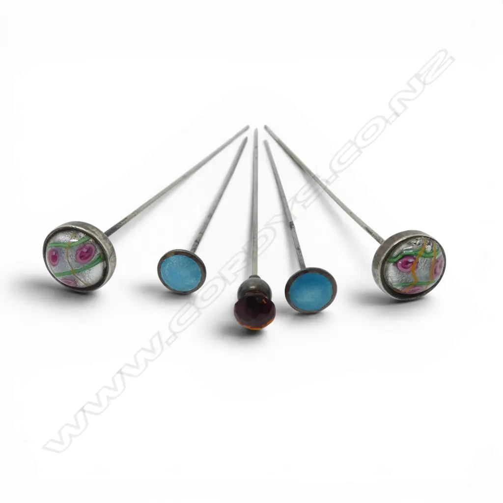5 early 20thC hatpins: 2 sterling with articulated heads + 2 enamel and one thistle Image 1++