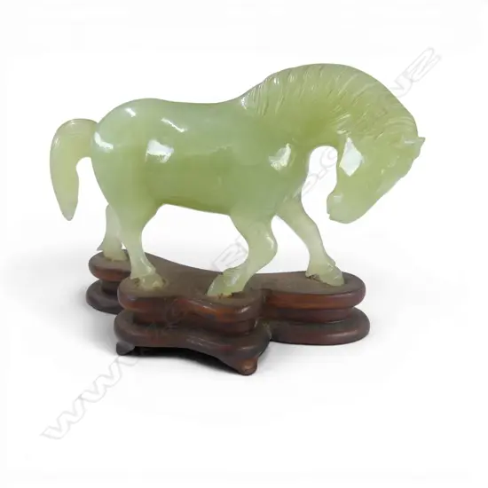 CHINESE PALE GREEN JADE CARVED HORSE head lowered chipped ear. On stand. L.130mm